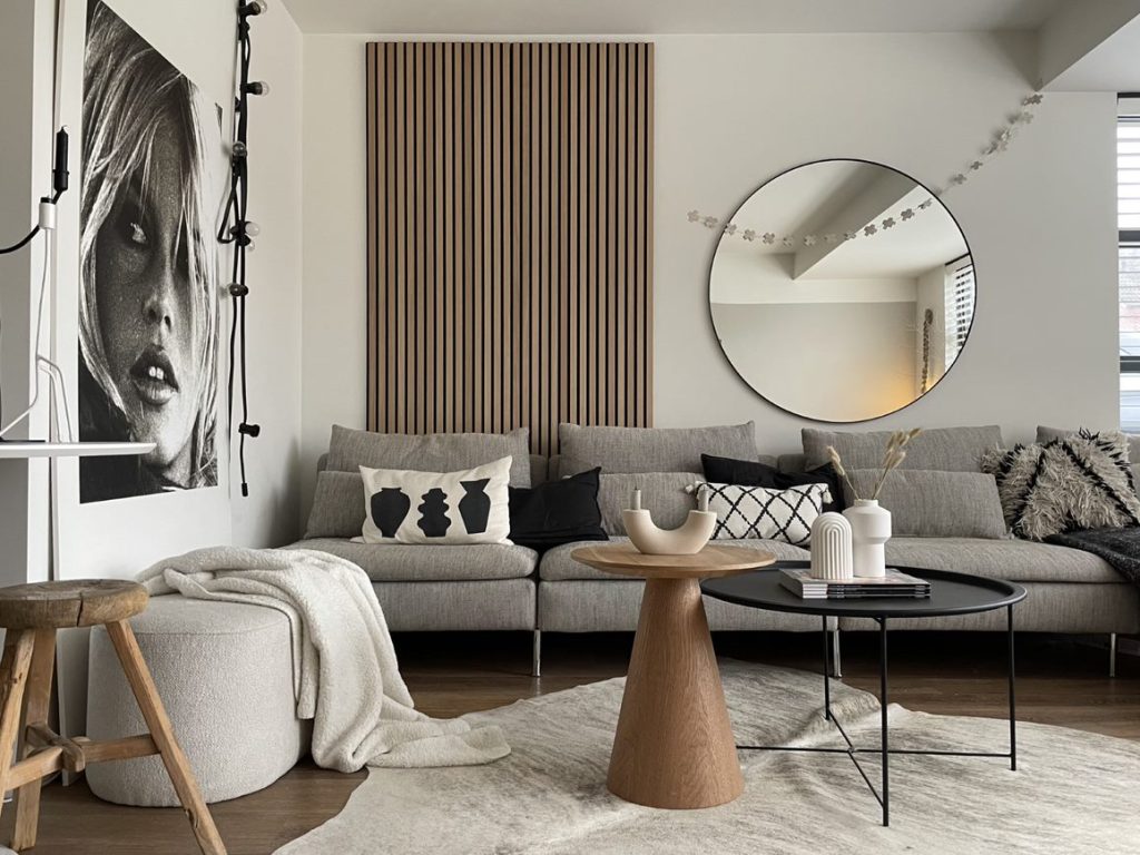 Classic oak, black felt behind a couch, next to a mirror, in a living room